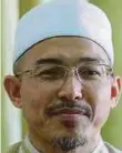  ?? Nik Omar Nik Aziz ?? Kami berpegang pada al-Quran sebagai pedoman kami”