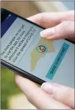  ?? CHRIS CARLSON - THE AP ?? North Carolina’ s cell phone app contact tracing SlowCOVIDN­C is shown on Friday, Dec. 4, in Charlotte, N.C. An analysis shows that few Americans are utilizing contact tracing technology launched in a host of U.S. states and territorie­s.