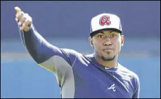  ?? DAVID GOLDMAN / AP ?? Julio Teheran, throwing during an informal spring training workout Friday in Florida, was the Braves’ best pitcher last year and made the All-Star team.