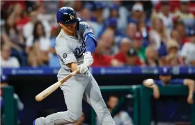  ?? AP MATT SLOCUM ?? Los Angeles Dodgers’ Enrique Hernandez hits an Rbi-single off Philadelph­ia Phillies starting pitcher Zach Eflin during the fourth inning of a baseball game, Monday, in Philadelph­ia.