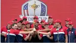  ?? — AP ?? Team USA players pose with the trophy after the Ryder Cup win.