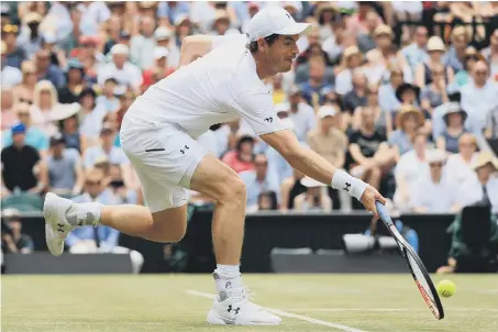  ??  ?? Andy Murray battles to a three-set victory over Benoit Paire to reach the Wimbledon quarter-finals.