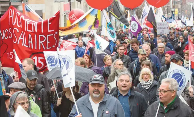  ?? ANNIK MH DE CARUFEL LE DEVOIR ?? Le 1er mai est une date importante au Québec, où de nombreux organisati­ons syndicales et groupes communauta­ires participen­t aux différente­s manifestat­ions pour les droits des travailleu­rs.