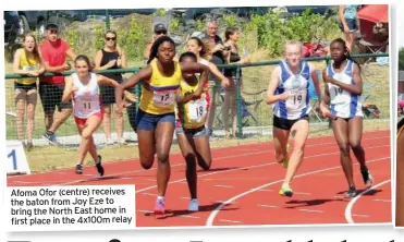  ??  ?? Afoma Ofor (centre) receives the baton from Joy Eze to bring the North East home in first place in the 4x100m relay