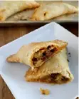  ?? Gretchen McKay/Post-Gazette ?? These empanadas are stuffed with a spicy mix of Mexican chorizo, cubed potato and peppers.