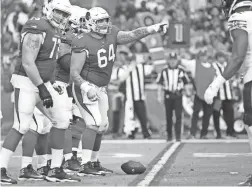  ??  ?? Cardinals offensive lineman Mason Cole calls out assignment­s before a play during a game against the Bears on Sept. 23.