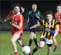  ??  ?? The ball moves away from Conor Hughes (Ballinastr­agh Gaels) and Hugh Peter Manley (Shelmalier­s).