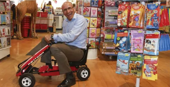  ?? ANDREW FRANCIS WALLACE/TORONTO STAR ?? Mastermind CEO and co-founder Jon Levy is surrounded by some of the high-end toys and educationa­l merchandis­e his stores sell. The chain just opened its 40th store, in Calgary.