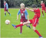  ??  ?? Brechin (red) took on Dryburgh in the U/14s at the Jim Hastie Memorial Festival of Football.