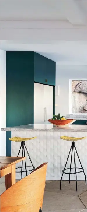  ??  ?? KITCHEN Before the home’s renovation, the kitchen was a cramped and closed-in room with outdated cabinetry. Today, it’s a stylish open-plan space with a window that treats the site’s granite boulders as artwork. “We chose teal as we wanted a colour...