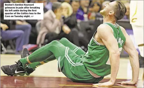  ?? AP ?? Boston’s Gordon Hayward grimaces in pain after breaking his left ankle during the first quarter of the Celtics loss to the Cavs on Tuesday night.