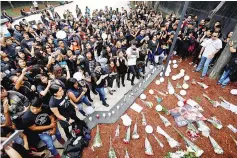  ??  ?? Fans gather at Revolucion monument to pay tribute to Chester Bennington, Linkin Park frontman, following the singer’s death by suicide, in Mexico City, Mexico, July 23. — Reuters photo