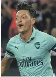  ??  ?? Mesut Ozil opened the scoring for Arsenal against PSG