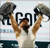  ?? AP/JOHN LOCHER ?? Conor McGregor holds up belts during a news conference Thursday in Las Vegas for the UFC 229 bouts. McGregor is scheduled to fight Khabib Nurmagomed­ov tonight in Las Vegas.