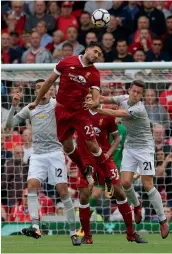  ?? —AP ?? Liverpool’s Emre Can in action against Manchester United’s Ander Herrera (right) in their EPL match at Anfield in Liverpool on Saturday.