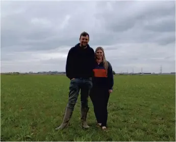  ?? ?? Hannah Hetheringt­on and Tom Martin on their farm in Outwell.