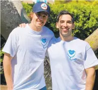  ?? COURTESY OF DAKOTA TIMM ?? Dakota Timm, left, and Jason Friedman of Virginia Beach created a T-shirt to raise funds for nurses.