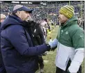  ?? MIKE ROEMER AND REED HOFFMANN — THE ASSOCIATED PRESS ?? Bears head coach Matt Nagy, above left shaking hands with Packers head coach Matt LaFleur, was a longtime assistant under former Eagles head coach Andy Reid, right.