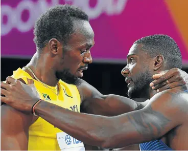  ?? /AFP ?? Brothers in arms: New world 100m champion Justin Gatlin, right, embraces Usain Bolt after the final in London on Saturday night. Gatlin served a doping ban in 2006-10 and the Daily Telegraph said after the race, ‘you may never see a greater anticlimax’.