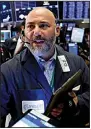  ?? AP/RICHARD DREW ?? Trader Vincent Napolitano works Tuesday at the New York Stock Exchange as stocks rebounded on the news of tariff delays.