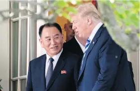  ?? ANDREW HARNIK / THE ASSOCIATED PRESS ?? President Donald Trump talks with Kim Yong Chol, former North Korean military intelligen­ce chief and one of leader Kim Jong Un’s closest aides, as they walk from their meeting in the Oval Office of the White House on Friday.