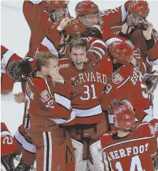  ?? STAFF PHOTO BY MATT WEST ?? ON A ROLL: Goalie Merrick Madsen (center) and the Crimson have their sights set on a championsh­ip, but they’re taking it one game at a time.