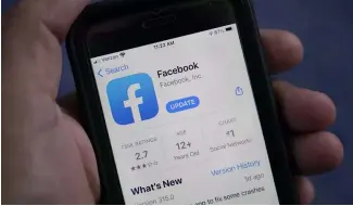  ?? ?? FILE - The Facebook app is shown on a smartphone.