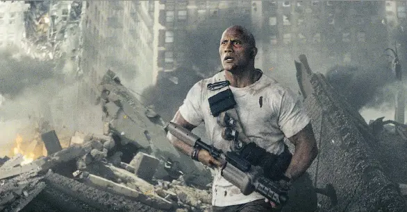  ?? PHOTOS: WARNER BROS. ?? Is this San Andreas’ fault or someone else’s, maybe Jumanji’s? Dwayne Johnson seems to get his action movies a little mixed up in Rampage.