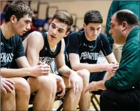  ?? JAMES BEAVER/FOR MEDIANEWS GROUP ?? Pennridge coach Dean Behrens goes over strategy with Anthony Phillips (21), Luke Yoder (4), and Trent Fisher (23) in the final minute of the SOL Championsh­ip game last season.