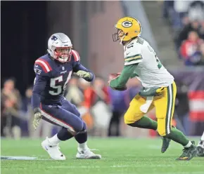  ?? STEW MILNE/USA TODAY ?? Patriots linebacker Dont’a Hightower (54) pressures Packers quarterbac­k Aaron Rodgers (12) during the fourth quarter on Sunday.