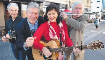  ?? Picture: GLENN FERGUSON ?? Geelong will host the Folk Alliance Internatio­nal ExChange Conference next year. Pictured are musician Jamie McKew, Mayor Bruce Harwood, musician Marcia Howard and Cr Jim Mason.