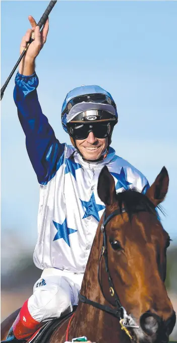  ?? Picture: ALBERT PEREZ/AAP ?? Jockey Michael Cahill after riding The Bostonian to victory in yesterday’s Kingsford Smith Cup, during Stakes Day at Eagle Farm