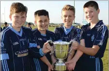  ??  ?? The St Colmcille’s Under-12s captains and vice-captains with the Leinster trophy, (l to r) Oisin Corcoran , Andrew Breen , Daire Reidy and Oran Collins.
