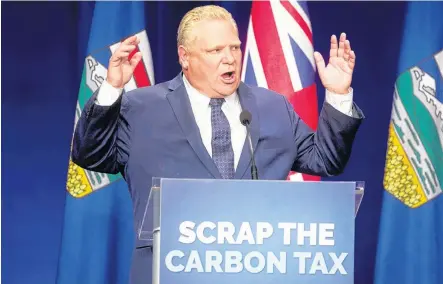  ?? POSTMEDIA FILE PHOTO ?? Ontario Premier Doug Ford speaks at an anti-carbon tax rally in Calgary on Oct. 5, 2018.