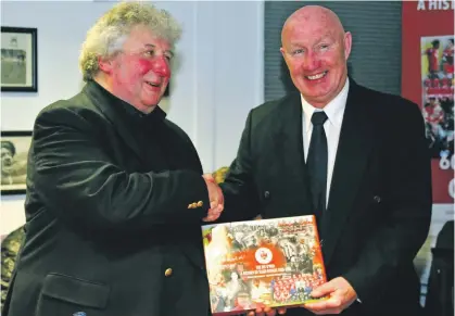  ?? ?? Aidan Mannion presenting a copy of the Sligo Rovers history book he edited to Bit O’Red legend Paul McGee.