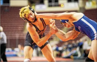  ?? NATE HECKENBERG­ER — FOR DIGITAL FIRST MEDIA ?? Boyertown’s David Campbell, left, works against Exeter’s Chris Matthews during Thursday night’s match at the PIAA Team Wrestling Championsh­ips in Hershey.