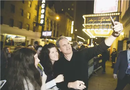  ?? BRIAN BRANCH PRICE FOR THE WASHINGTON POST ?? Michael Park, who plays the father of a deceased teenager in the Broadway musical “Dear Evan Hansen,” greets the show’s fans after a recent performanc­e at the Music Box Theatre in New York.