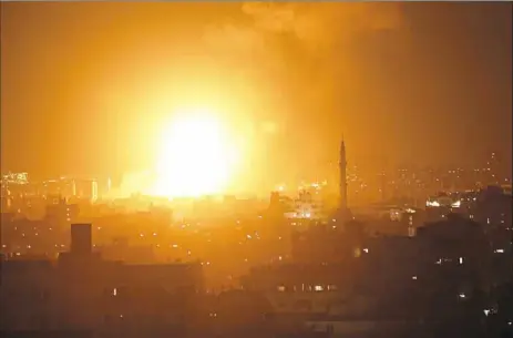  ?? Mahmud Hams/AFP/Getty Images ?? A fireball explodes Wednesday during Israeli air strikes on Gaza City.