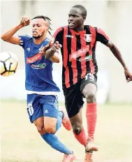  ??  ?? Portmore United’s Maalique Foster (left) and Arnett Gardens’ Fabian Reid battling during a Red Stripe Premier League encounter at the Spanish Town Prison Oval.