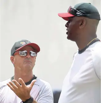  ??  ?? Courtney Walsh, Bangadesh Bowling coach, speaks to head coach Steve Rhodes at a training session at Sabina Park in Kingston ahead their Test match against the West Indies on Thursday.