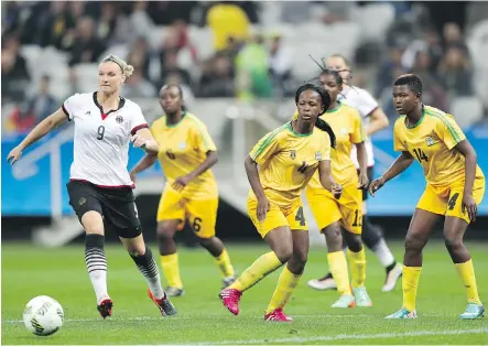  ?? ALEXANDRE SCHNEIDER/ GETTY IMAGES ?? Zimbabwe’s women’s soccer team was pounded by Germany in their opening match, but won over the crowd.