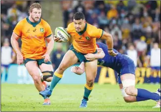  ??  ?? Australia’s Hunter Paisami runs at the defence during the rugby internatio­nal between France and Australia at Suncorp Stadium in Brisbane, Australia, on July 7. (AP)