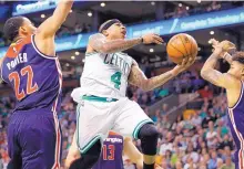  ?? MICHAEL DWYER/ASSOCIATED PRESS ?? Boston’s Isaiah Thomas (4) drives against Washington’s Otto Porter Jr. (22) during the opening game of a second-round NBA playoff series. Thomas scored 33 points and had nine assists.