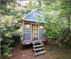  ??  ?? At left, Kevin Riedel has built a “tiny house” and a “micro house” in Richmond, Virginia. Above, Renee and Greg Cantori have built a “tiny house” that they plan to relocate to West Virginia.