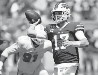  ?? JOHN MCCALL/SOUTH FLORIDA SUN SENTINEL ?? Bills quarterbac­k Josh Allen throws against the Dolphins on Sept. 19.