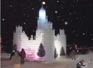  ?? EAGLE RIVER AREA CHAMBER OF COMMERCE ?? Colorful lights illuminate the 2022 ice castle in Eagle River.