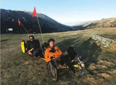  ??  ?? The Lowest to Highest journey (above) took the adaptive cyclists from Kati Thanda–Lake Eyre (–15.2m), 2152km to Mt Kosciuszko/ Targangil (2228m).Paul (left) with Duncan Meerding (in the back seat) on Day 40 at the summit of Dead Horse Gap (1580m).