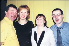  ?? ?? In party mood at the 2001 Watergrass­hill/Glenville GAA Dinner Dance in Midleton, were l-r: Paul and Julia McCarthy, along with Maureen Finucane and Bernard Burke.