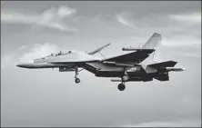  ?? JIANG ZHONGCHENG / FOR CHINA DAILY ?? A J-16D combat jet prepares to land at Zhuhai Jinwan Airport, Guangdong province, on Tuesday for the upcoming Zhuhai Airshow.