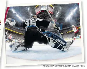  ?? — POSTMEDIA NETWORK, GETTY IMAGES FILES ?? From left: Jarome Iginla is tangled up with nemesis Chris Chelios; Iginla and Ryan Smyth look at their gold medals at the 2002 Winter Games; and Lightning goalie Nikolai Khabibulin makes a stop on Iginla during Game 5 of the 2004 Stanley Cup final.